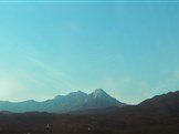 bossfight-free-stock-photos-mountains-sky-blue-house-orange